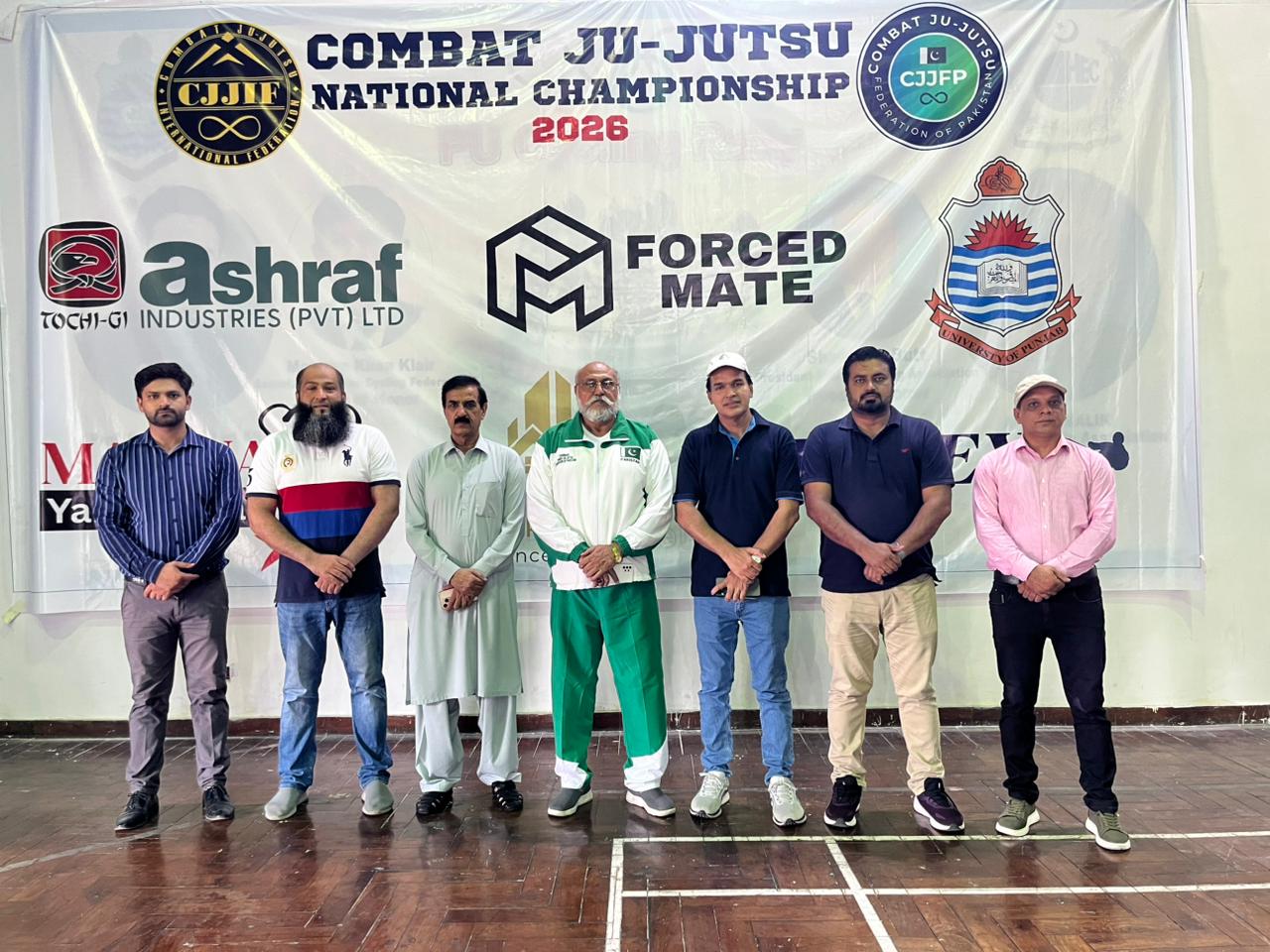 Match officials and technical directors collaborating during championship